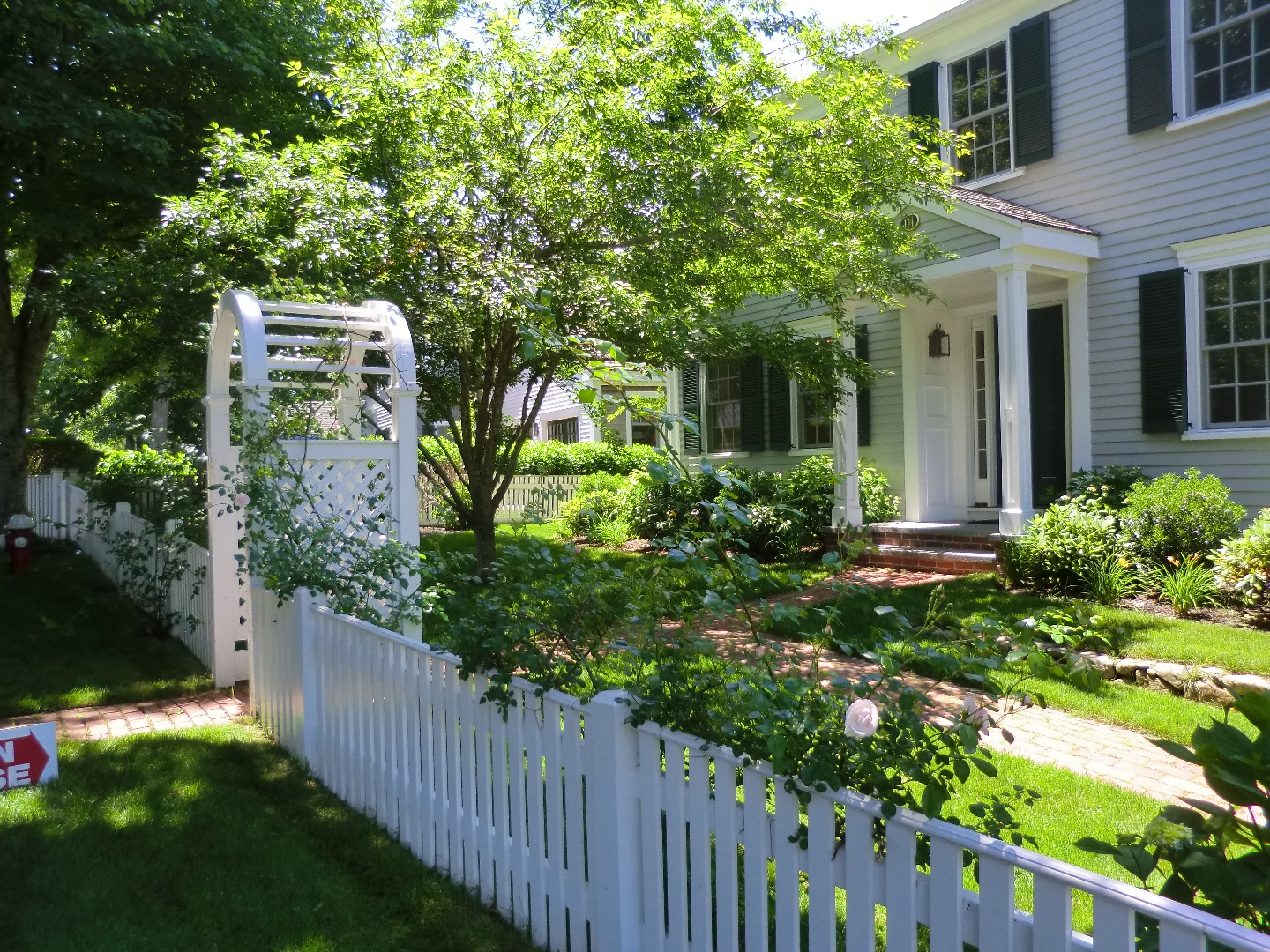 114 South Summer Street Edgartown, MA 02539 - Photo 100 of 102 a view of a house with a flower garden