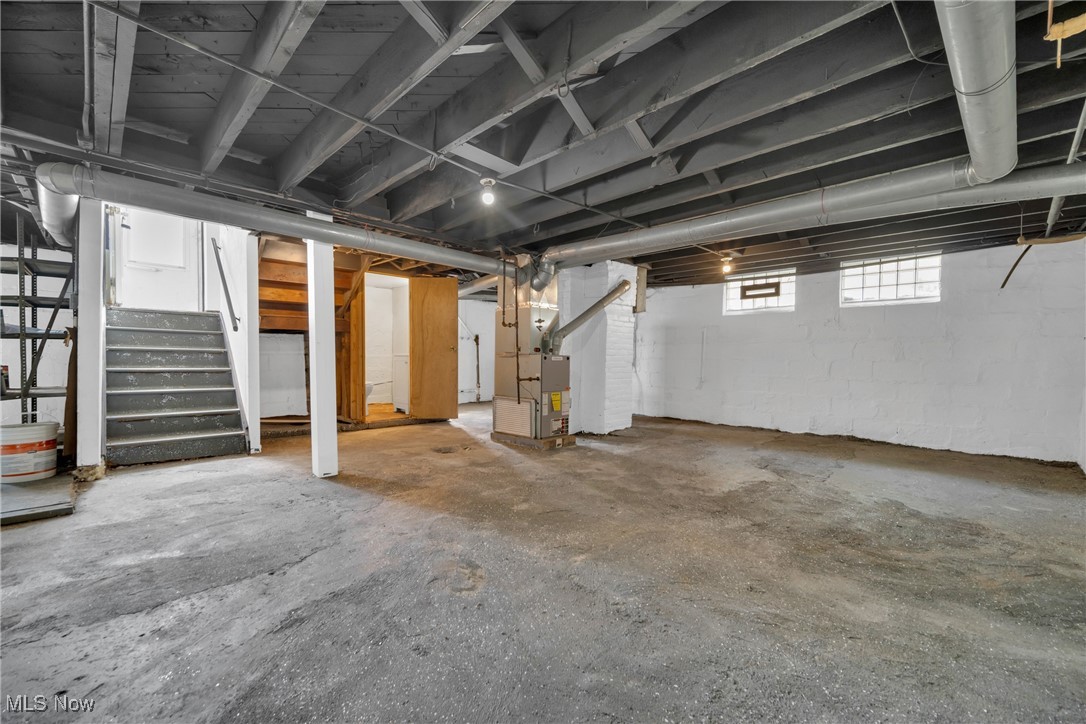 916 Nathaniel Road Cleveland, OH 44110 - Photo 27 of 28 Basement with heating unit