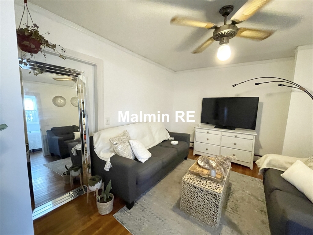 748 East 4th Street, Unit B Boston, MA 02127 - Photo 5 of 11 a living room with furniture and a flat screen tv