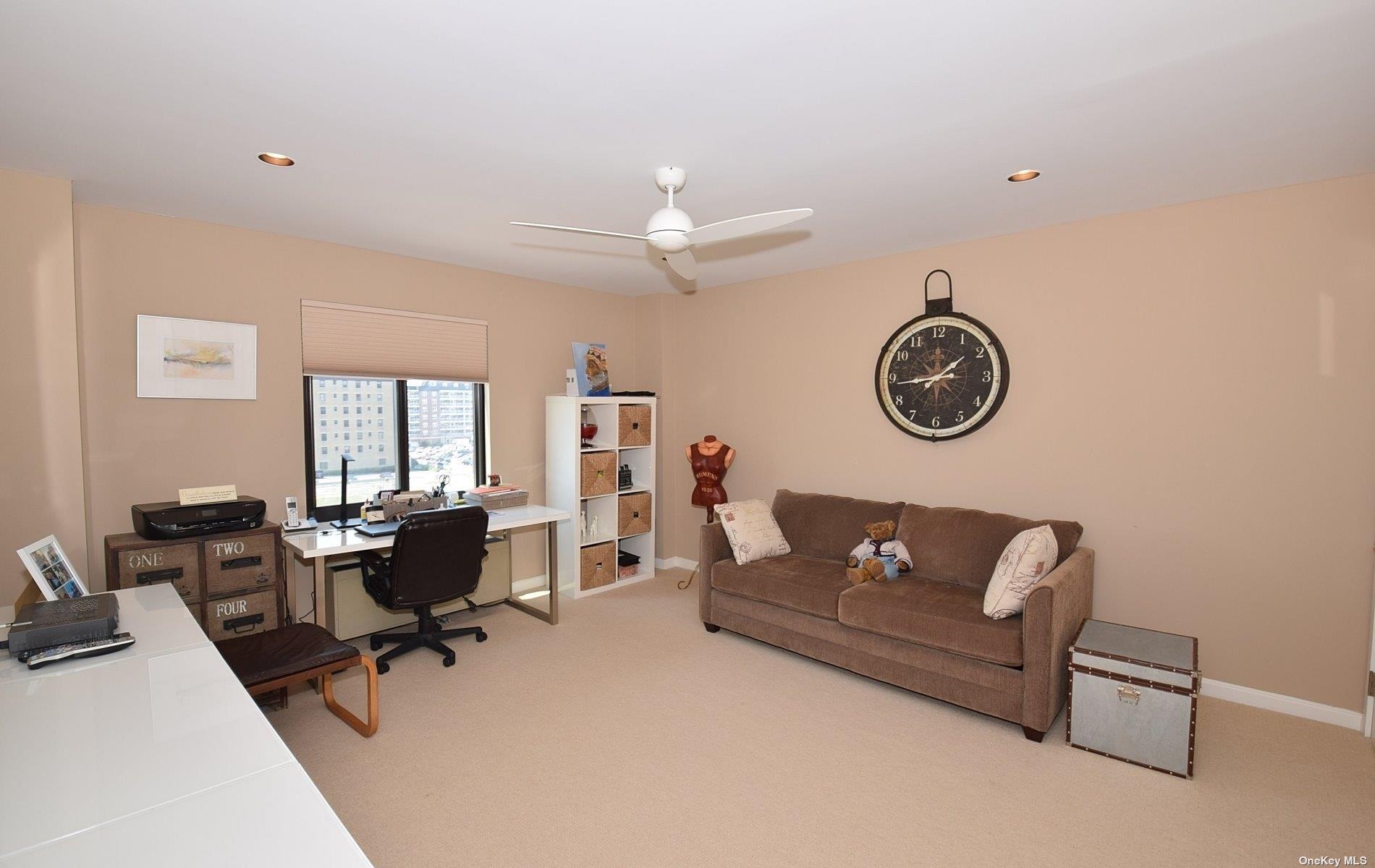 360 Shore Road, Unit 5E Long Beach, NY 11561 - Photo 18 of 21 a view of a livingroom with workspace and a couch