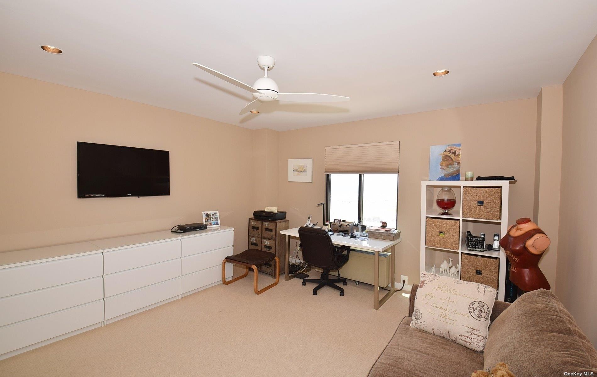 360 Shore Road, Unit 5E Long Beach, NY 11561 - Photo 19 of 21 a view of a livingroom with workspace and a window