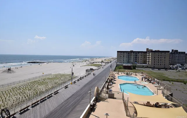 a view of a balcony with an ocean view
