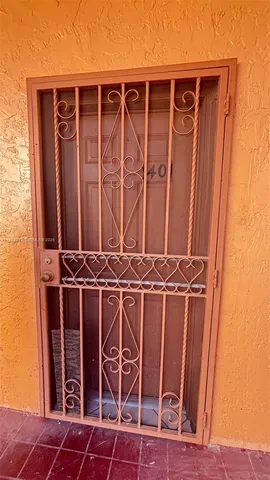 an empty room with a wooden door