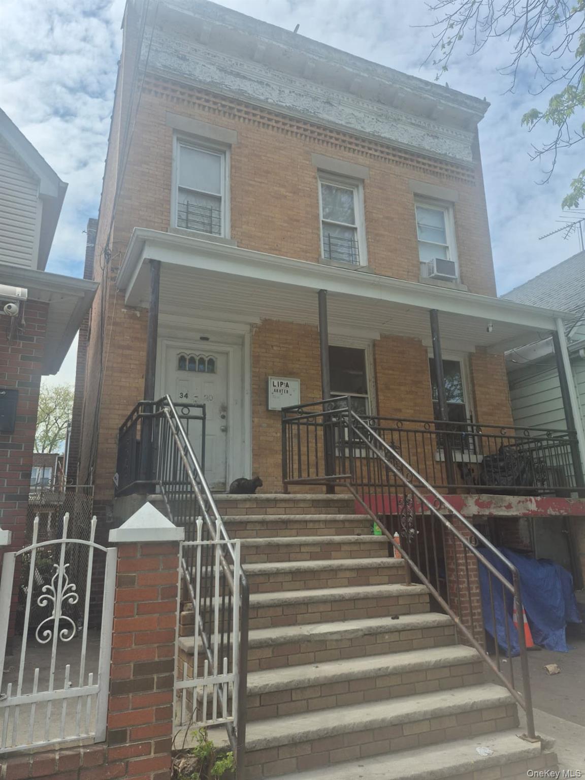 34-20 100th Street Queens, NY 11368 - Photo 1 of 4 a view of entryway with a front door