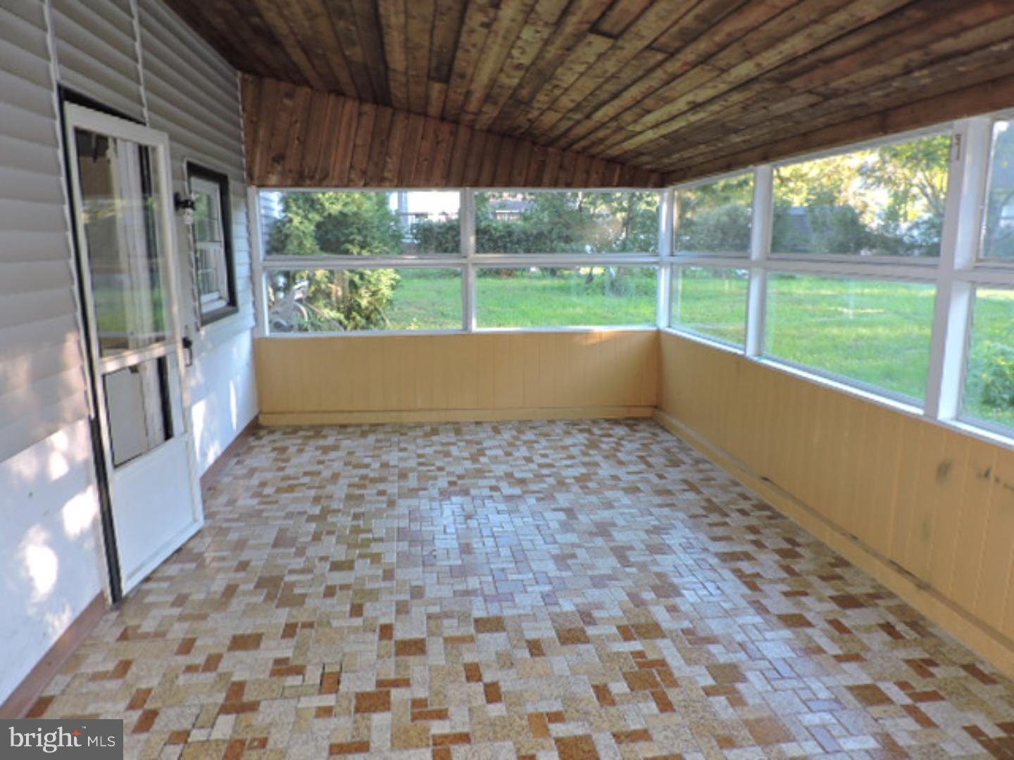 819 Haddonfield-Berlin Road Cherry Hill, NJ 08034 - Photo 14 of 22 a view of empty room with wooden floor and outdoor space