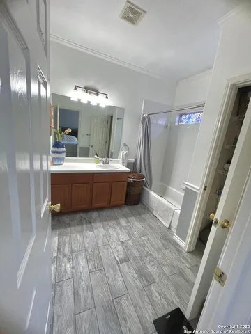 a room with a bed and a mirror