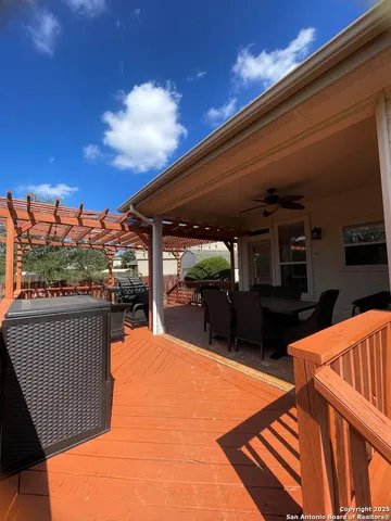a view of a patio with a table and chairs