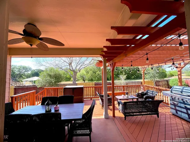 a view of a outdoor seating area with furniture and wooden floor