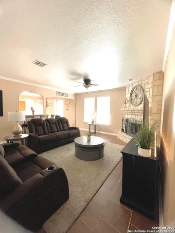 a living room with furniture and a large window