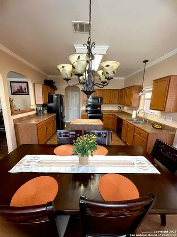 a room with table and chairs