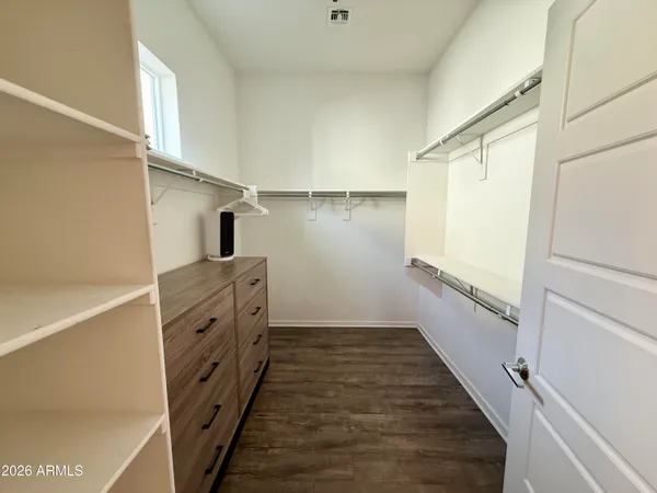 a view of an empty walk in closet