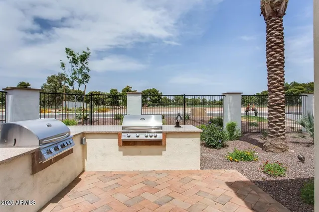 a view of a patio with couches and potted plants