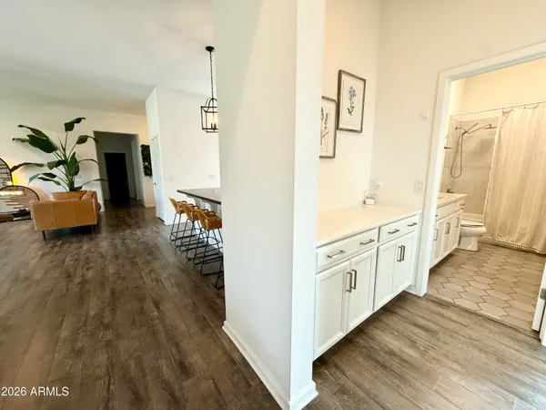 a spacious bathroom with a double vanity sink and a mirror