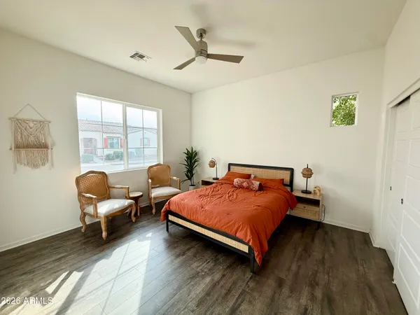 a bedroom with a bed and a couch