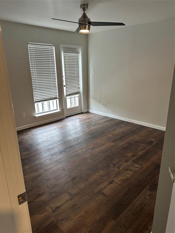 4520 Speedway, Unit A Austin, TX 78751 - Photo 2 of 9 Unfurnished room with dark wood finished floors and ceiling fan