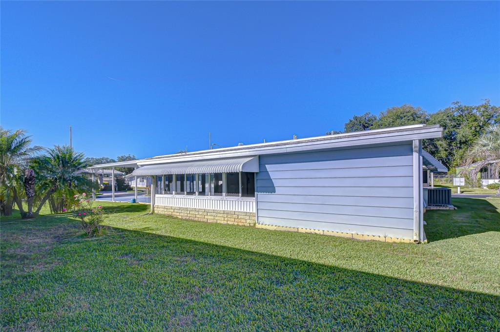 3210 Moonlight Street Wesley Chapel, FL 33543 - Photo 11 of 49 a view of a house with a backyard