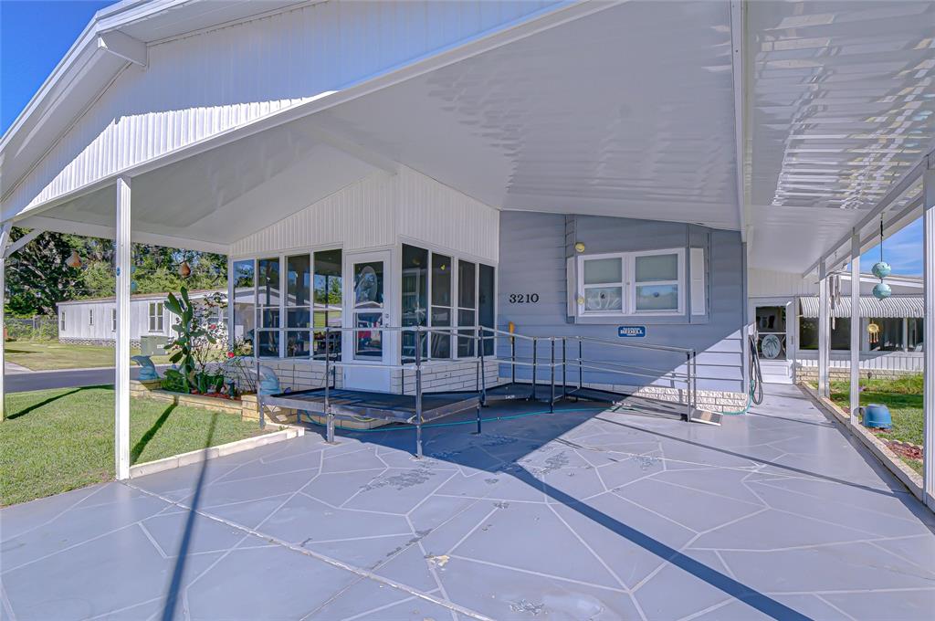 3210 Moonlight Street Wesley Chapel, FL 33543 - Photo 14 of 49 a view of a house with backyard and sitting area