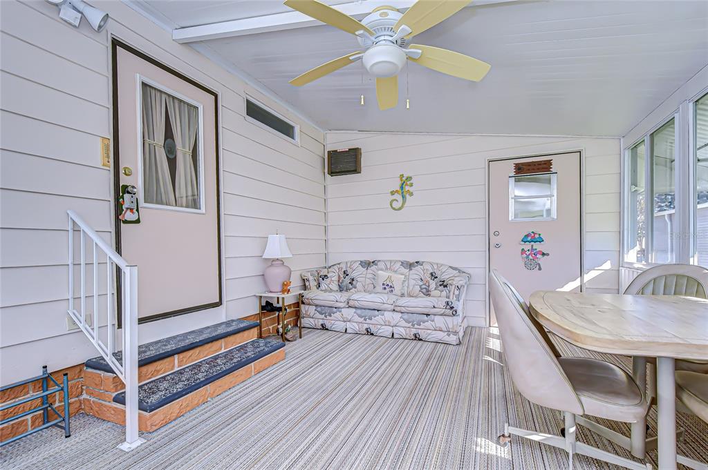 3210 Moonlight Street Wesley Chapel, FL 33543 - Photo 18 of 49 a living room with furniture and a wooden floor