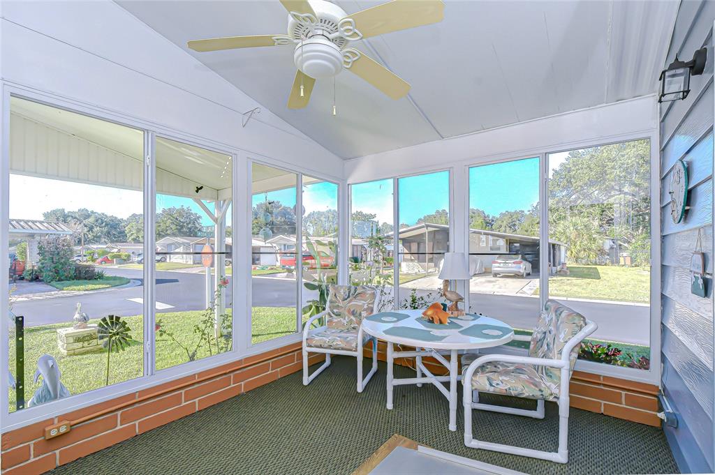 3210 Moonlight Street Wesley Chapel, FL 33543 - Photo 23 of 49 a outdoor dining room with furniture window and outdoor view