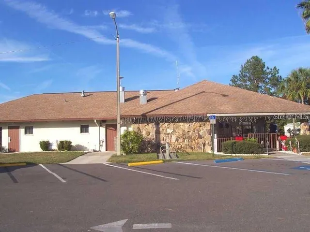 a view of a chairs and table in patio