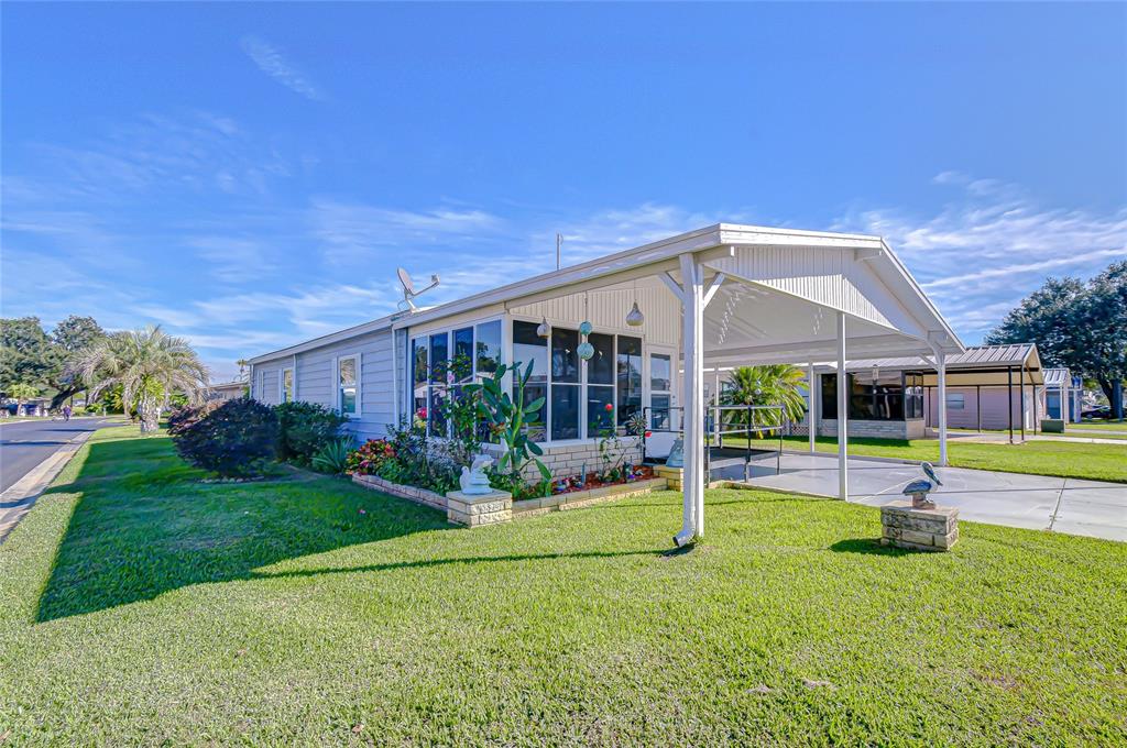 3210 Moonlight Street Wesley Chapel, FL 33543 - Photo 5 of 49 a front view of house with yard and green space