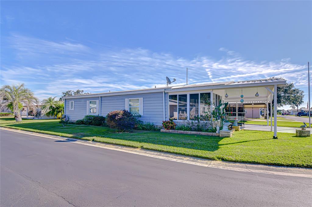 3210 Moonlight Street Wesley Chapel, FL 33543 - Photo 6 of 49 a front view of a house with a yard and garage