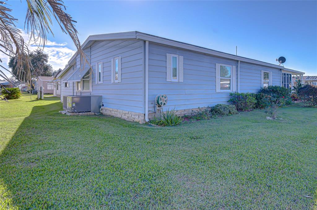 3210 Moonlight Street Wesley Chapel, FL 33543 - Photo 7 of 49 a front view of a house with garden