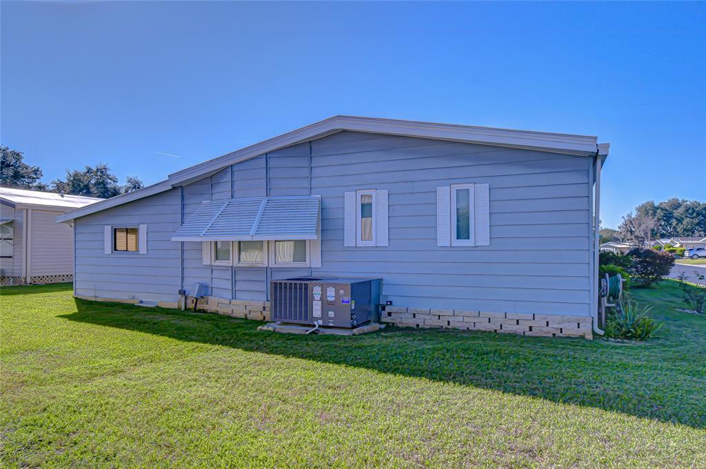 3210 Moonlight Street Wesley Chapel, FL 33543 - Photo 8 of 49 a view of a house with a yard
