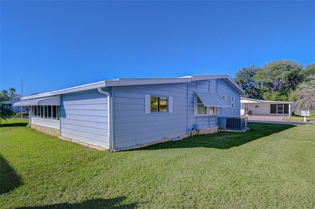 3210 Moonlight Street Wesley Chapel, FL 33543 - Photo 9 of 49 a view of a house with a yard