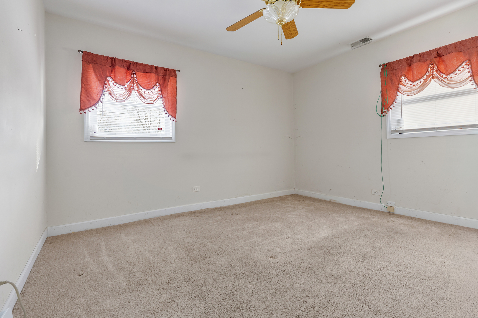 14305 Kostner Avenue Midlothian, IL 60445 - Photo 12 of 22 an empty room with windows