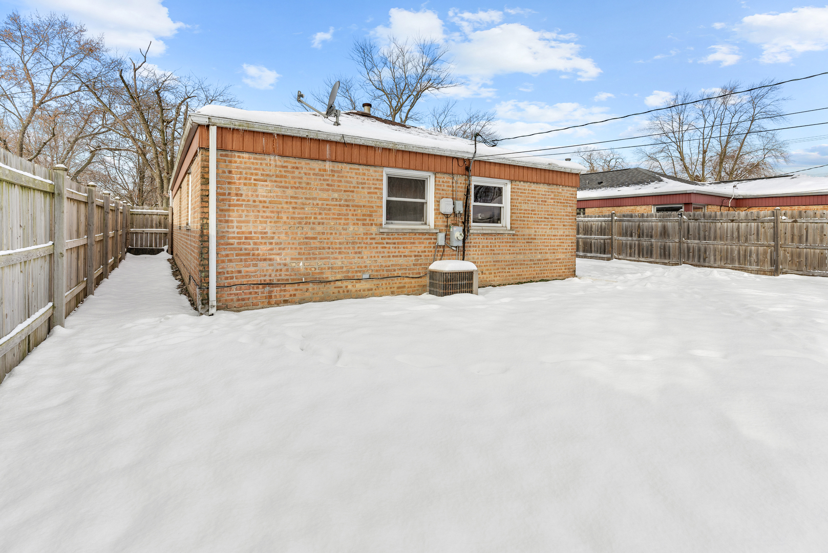 14305 Kostner Avenue Midlothian, IL 60445 - Photo 16 of 22 a view of a house with a wooden fence