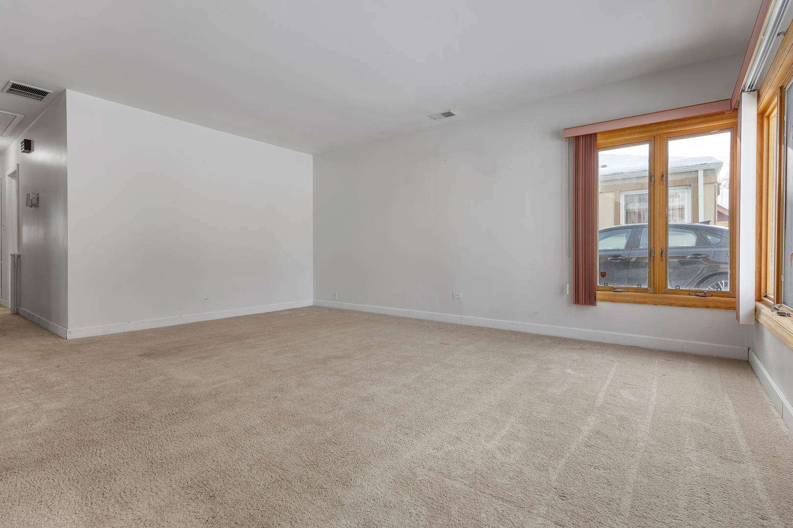 14305 Kostner Avenue Midlothian, IL 60445 - Photo 6 of 22 an empty room with windows