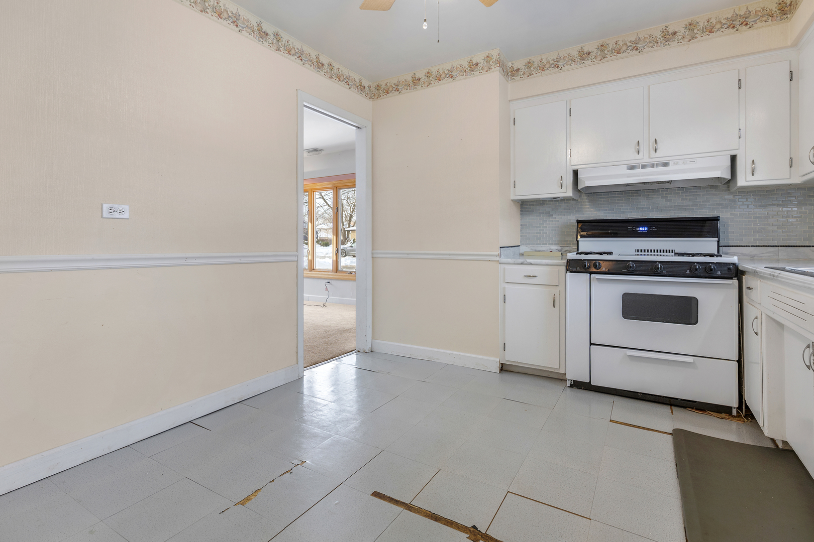 14305 Kostner Avenue Midlothian, IL 60445 - Photo 8 of 22 a kitchen with granite countertop white cabinets and white appliances