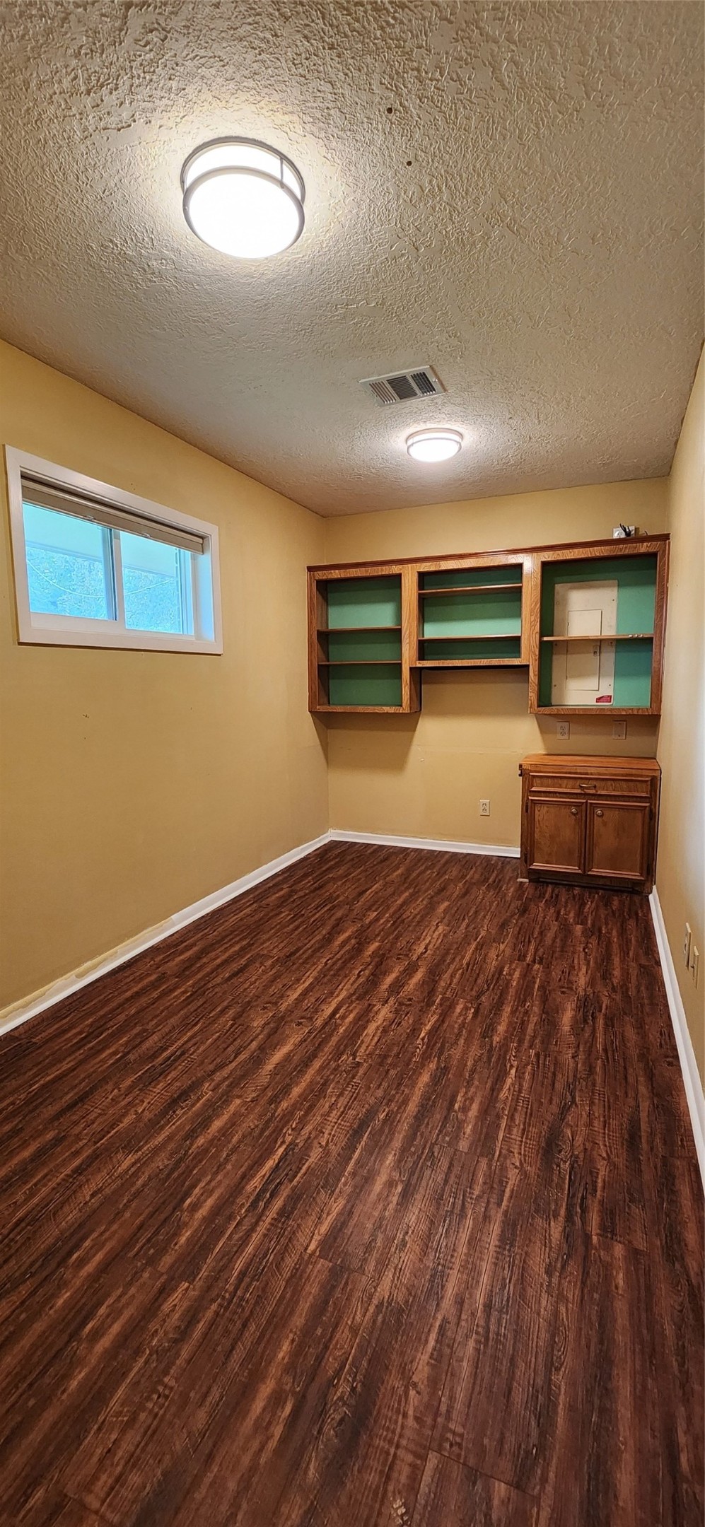 616 Cannan Drive Angleton, TX 77515 - Photo 11 of 44 a view of empty room with wooden floor