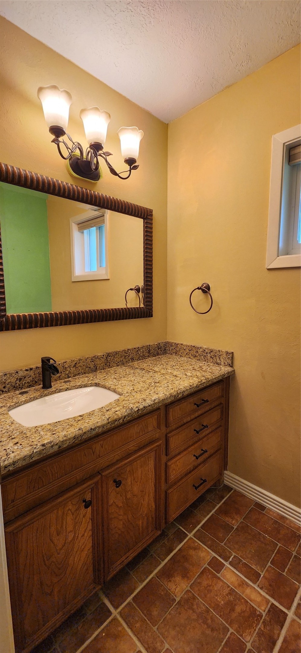 616 Cannan Drive Angleton, TX 77515 - Photo 12 of 44 a bathroom with a sink and a mirror