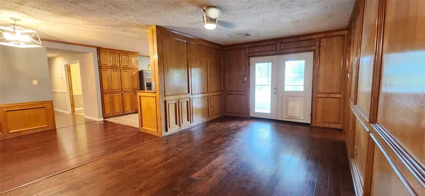a view of a refrigerator in kitchen and wooden floor