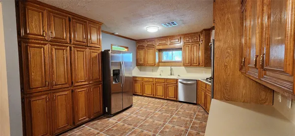 an empty room with a fireplace and painted walls