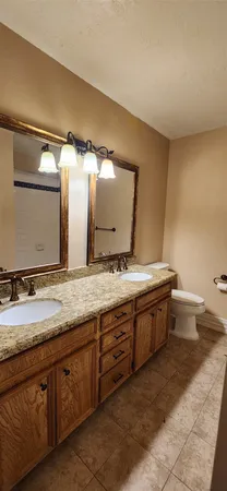 a view of empty room with ceiling fan