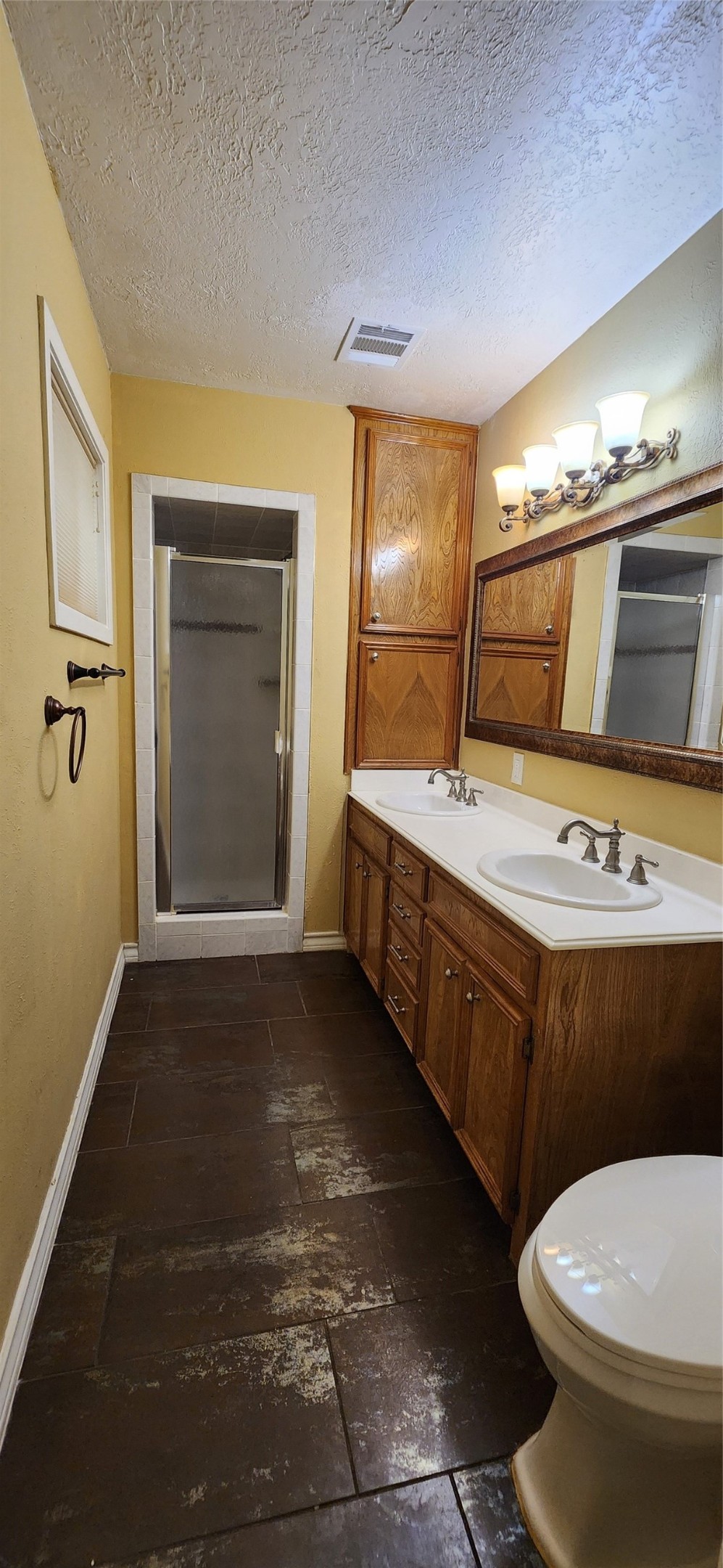 616 Cannan Drive Angleton, TX 77515 - Photo 35 of 44 a bathroom with a sink a toilet and mirror