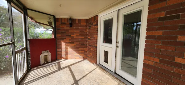 a view of a backyard with sitting area