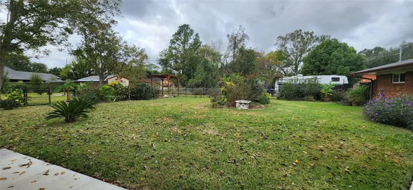 a backyard of a house with lots of green space