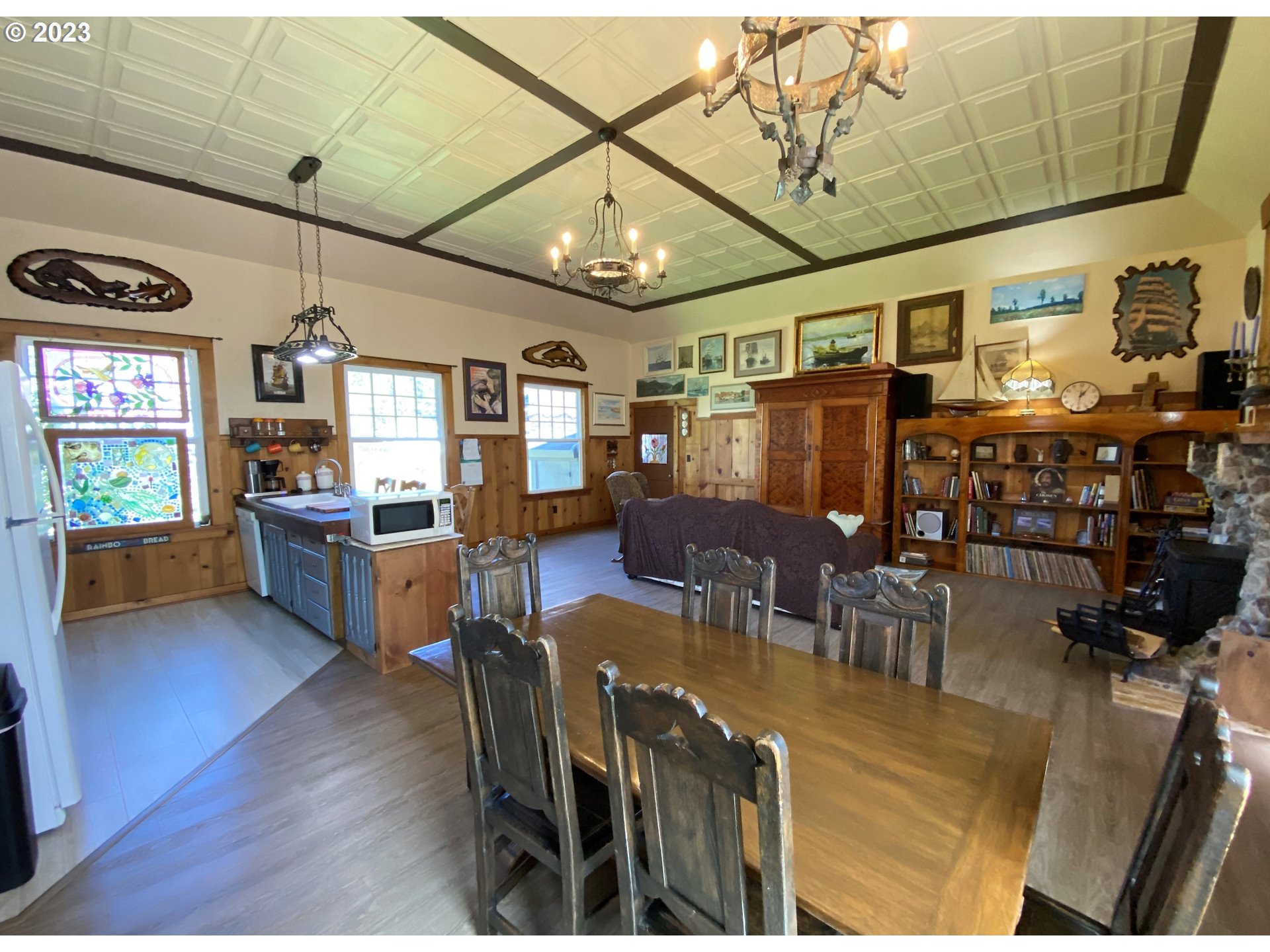 174 North 20th Street Reedsport, OR 97467 - Photo 11 of 43 a view of a dining room with furniture window and wooden floor