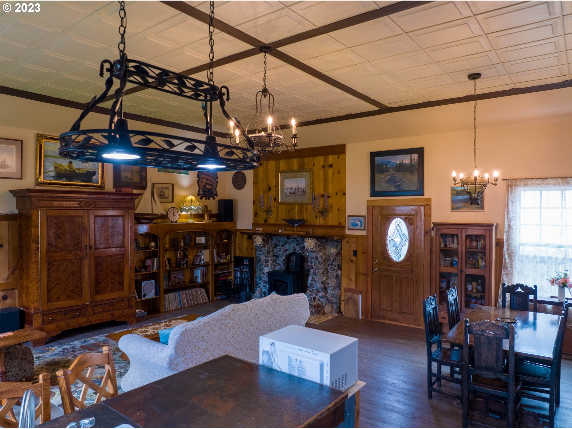 174 North 20th Street Reedsport, OR 97467 - Photo 12 of 43 a view of a dining room with furniture and chandelier