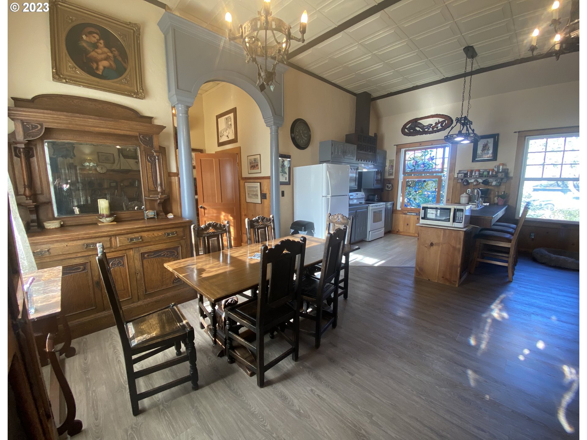 174 North 20th Street Reedsport, OR 97467 - Photo 16 of 43 a view of a dining room with furniture window and wooden floor