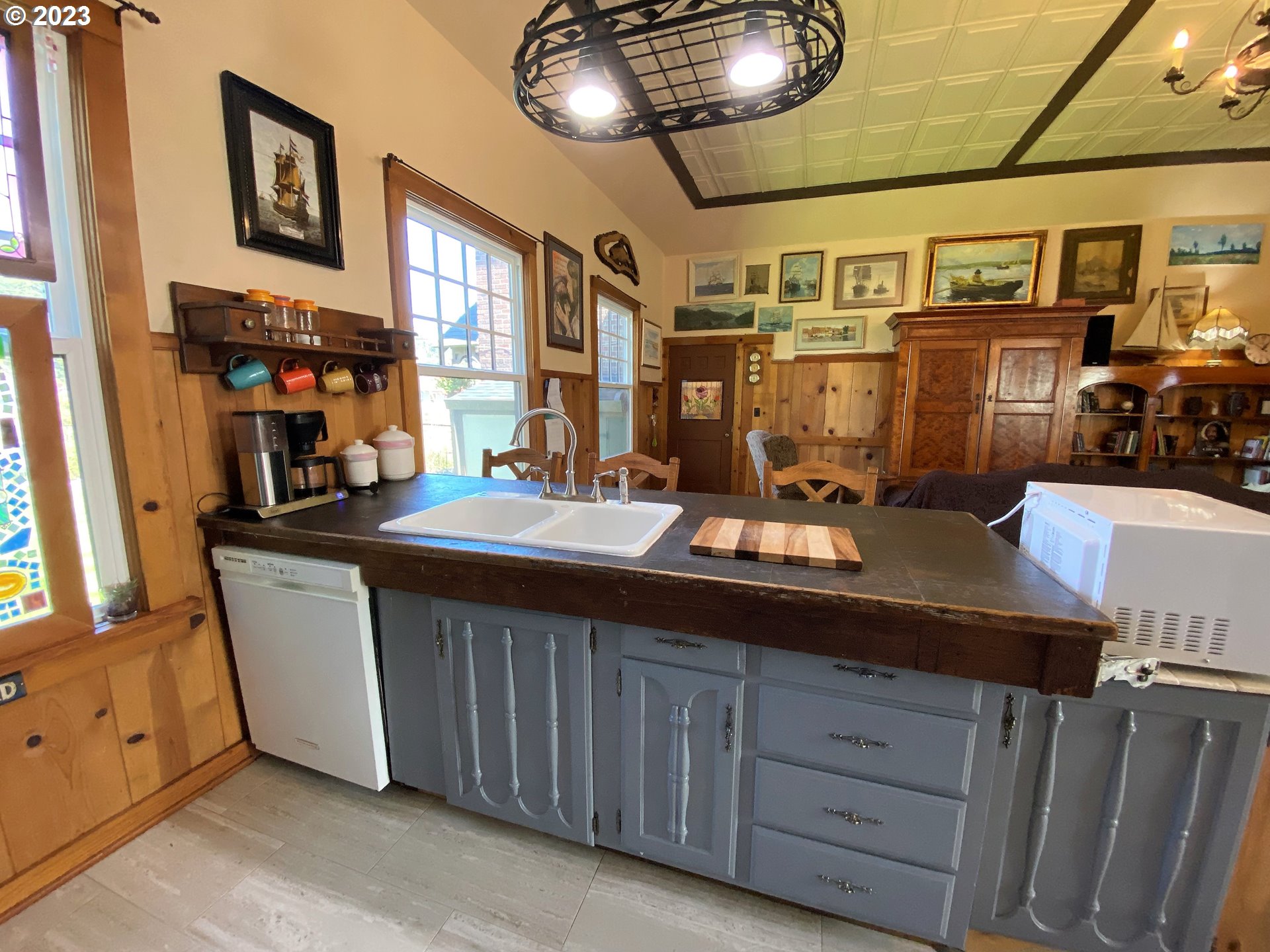 174 North 20th Street Reedsport, OR 97467 - Photo 20 of 43 a kitchen with a sink and cabinets