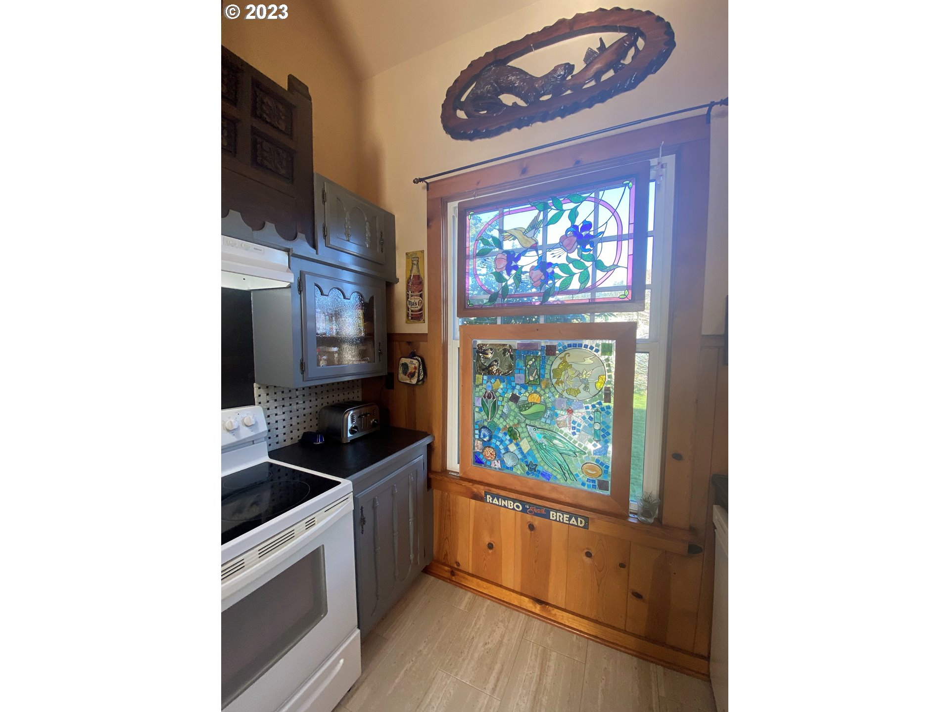 174 North 20th Street Reedsport, OR 97467 - Photo 21 of 43 a kitchen with a sink and a stove top oven