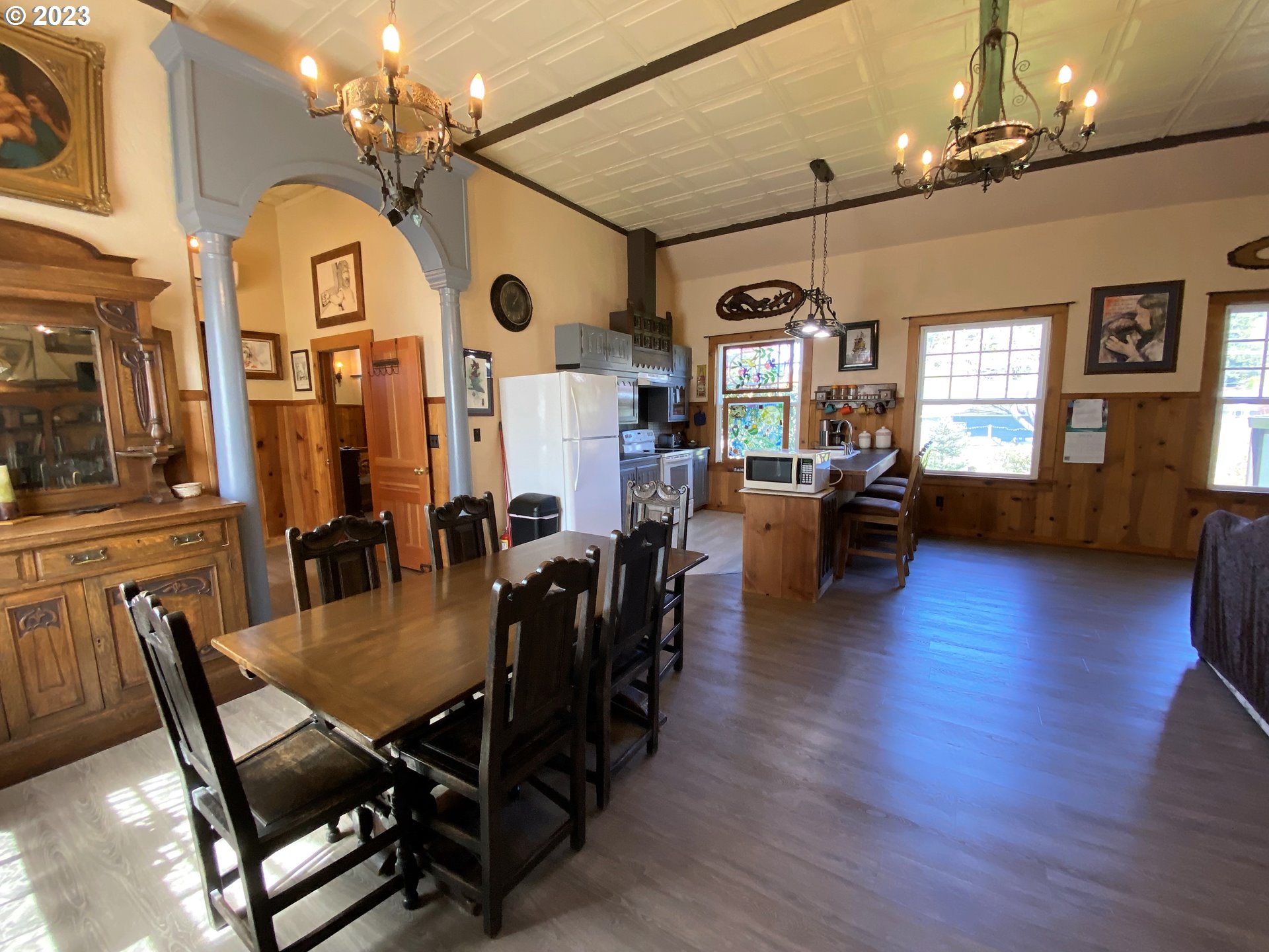174 North 20th Street Reedsport, OR 97467 - Photo 22 of 43 a view of a dining room with furniture window and wooden floor
