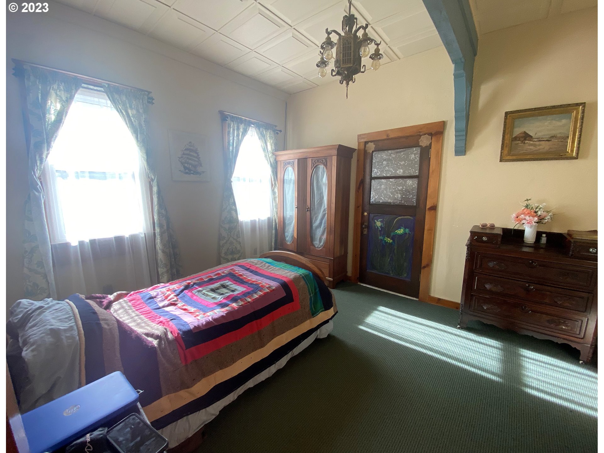 174 North 20th Street Reedsport, OR 97467 - Photo 28 of 43 a bed room with a bed and a window