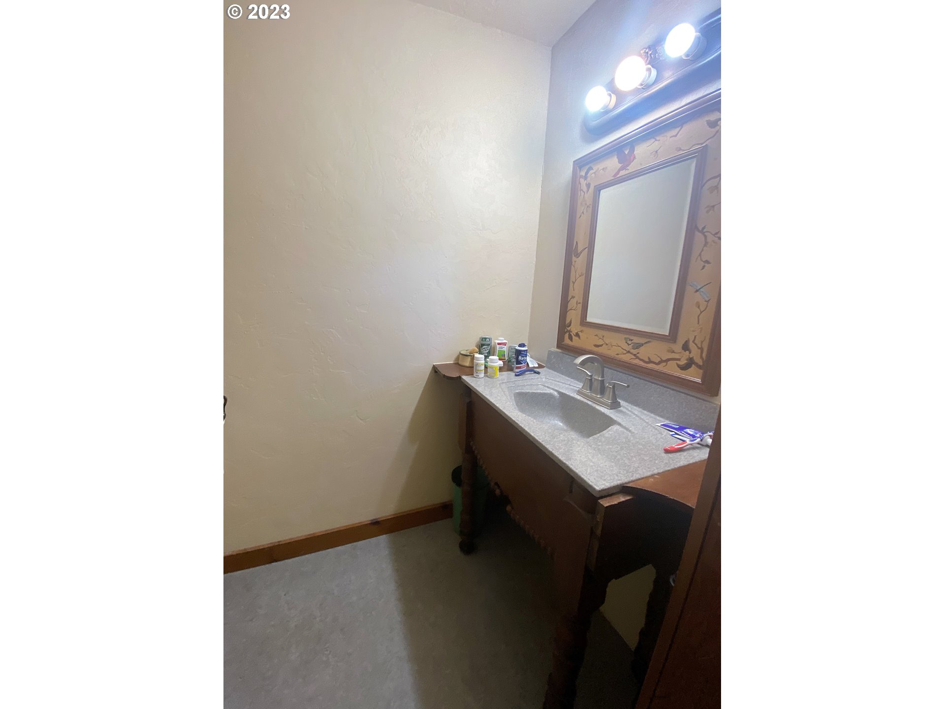 174 North 20th Street Reedsport, OR 97467 - Photo 29 of 43 a bathroom with a sink and a mirror