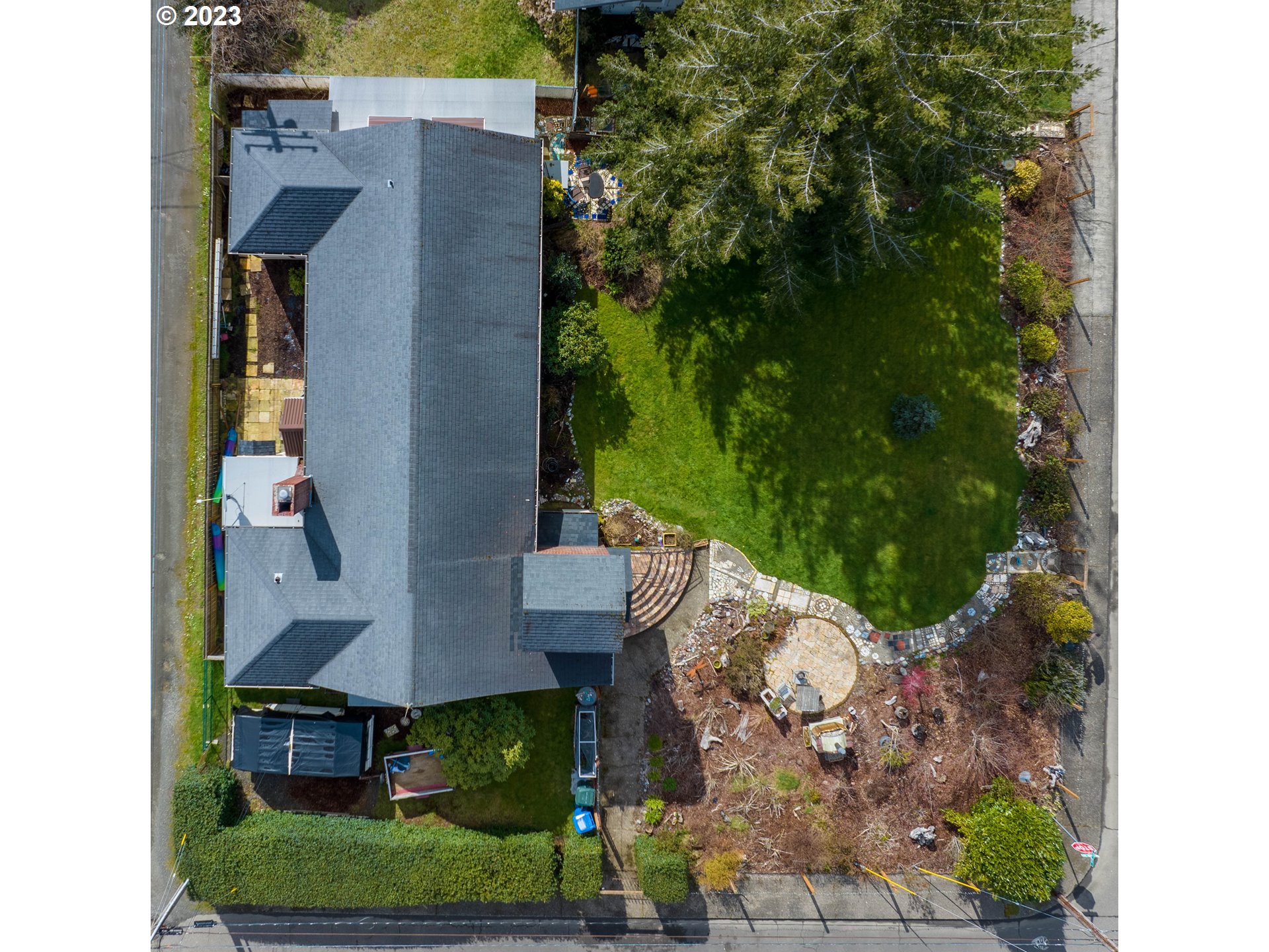 174 North 20th Street Reedsport, OR 97467 - Photo 4 of 43 an aerial view of a house with a yard basket ball court and outdoor seating